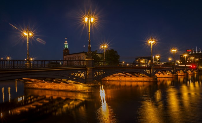 Stockholm bridge at night with reflections