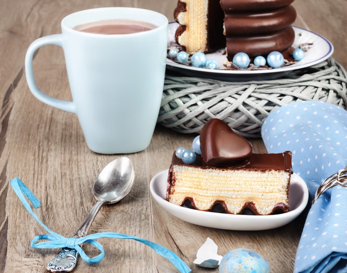 Chocolate cake with hot chocolate and spoon