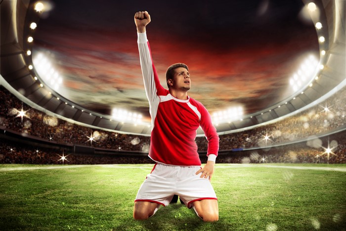 Soccer player celebrating in a stadium