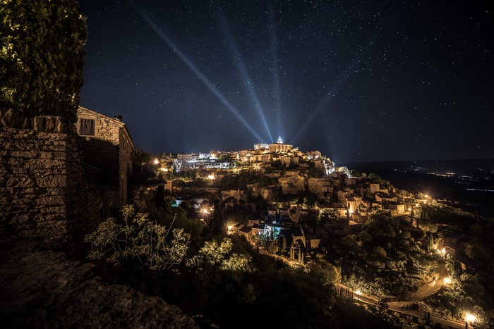 Gordes, France at Night with Stars and Light Rays