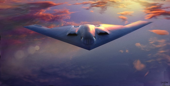 B-2 Spirit bomber flying at sunset