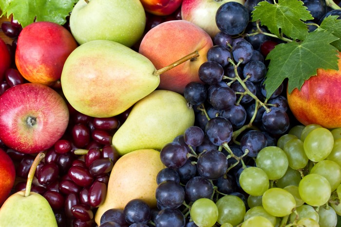 Assortment of Fresh Fruits: Grapes, Apples, Pears, and Peaches
