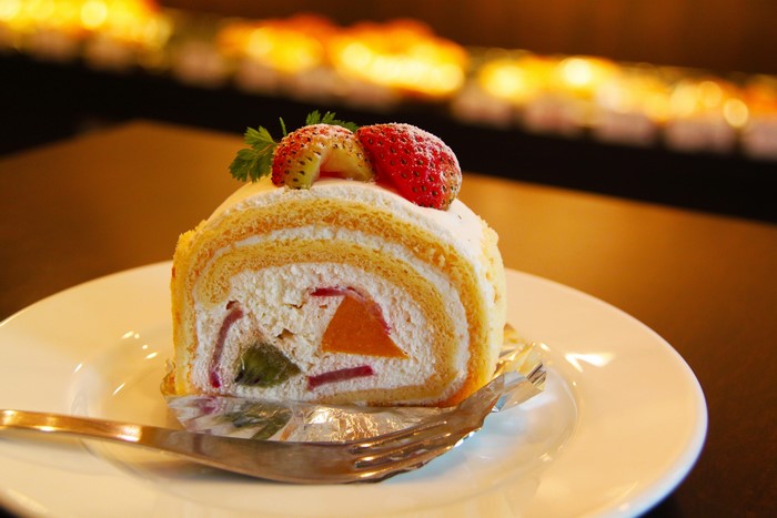 Slice of Swiss Roll Cake with Strawberries