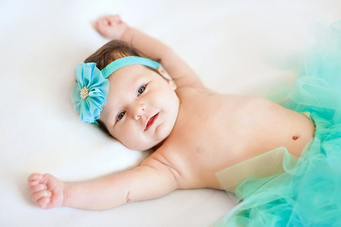 Baby girl with blue headband and tutu