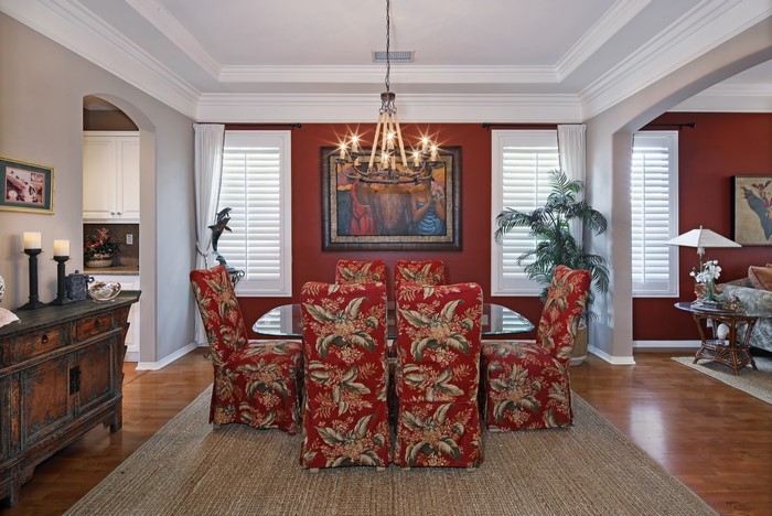 Dining Room with Chandelier and Floral Chairs
