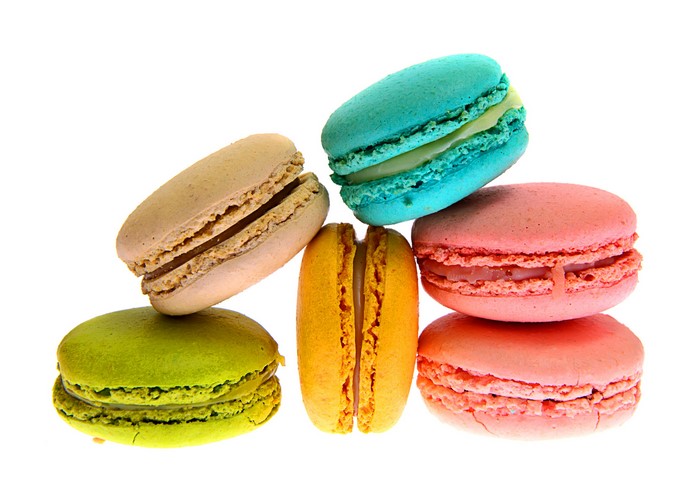 Assortment of colorful macarons on a white background