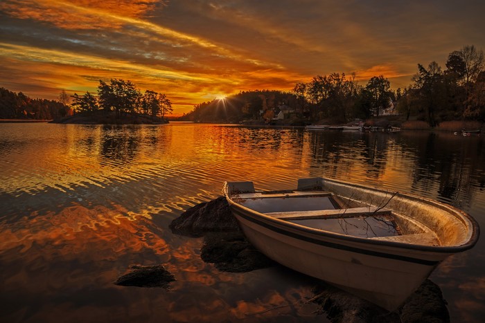 Boat on a lake at sunset