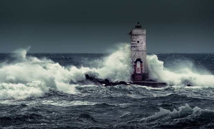 Mangiabarche lighthouse in Calasetta, Italy during a storm