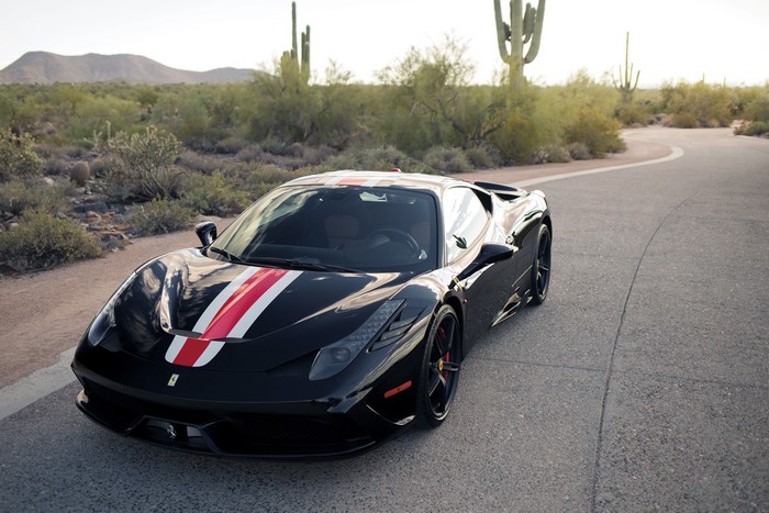 Black Ferrari 458 Speciale with racing stripes