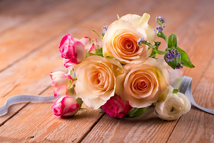 Bouquet of Roses on Wood Planks