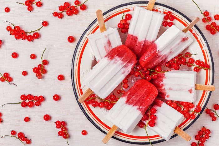 Red Currant Ice Pops on a Plate with Berries