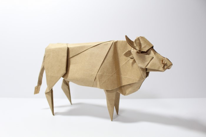 Origami cow on a white background