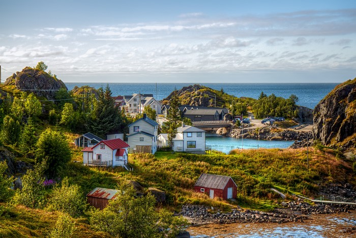 Coastal village with houses and the sea in Norway