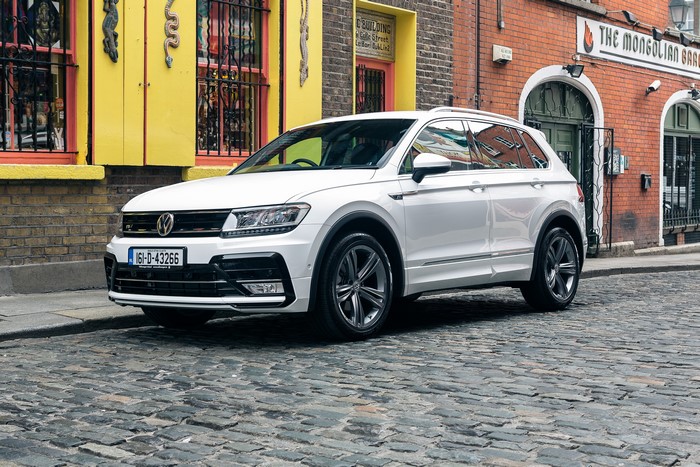 White Volkswagen Tiguan R-Line on Cobblestone Street