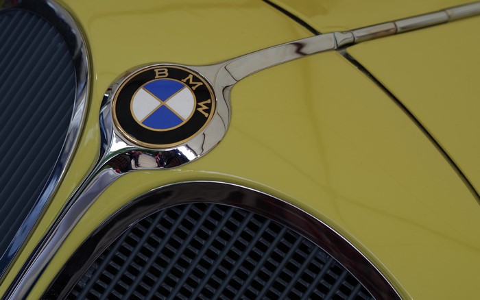 BMW Logo Emblem on Yellow Car