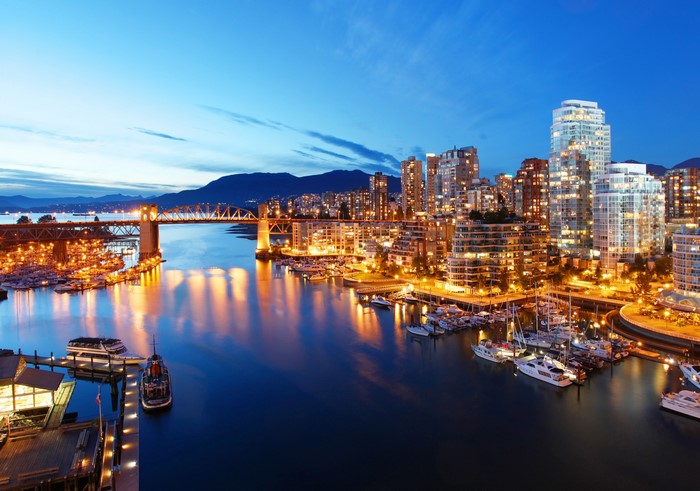 Vancouver cityscape with bridge and marina at dusk