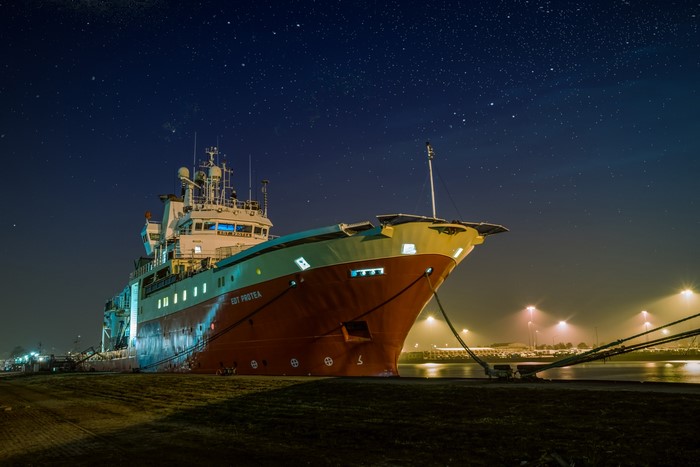 EDT PROTEA Ship docked at night under starry sky