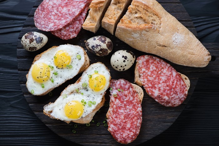 Fried Quail Eggs on Toast with Salami and Bread