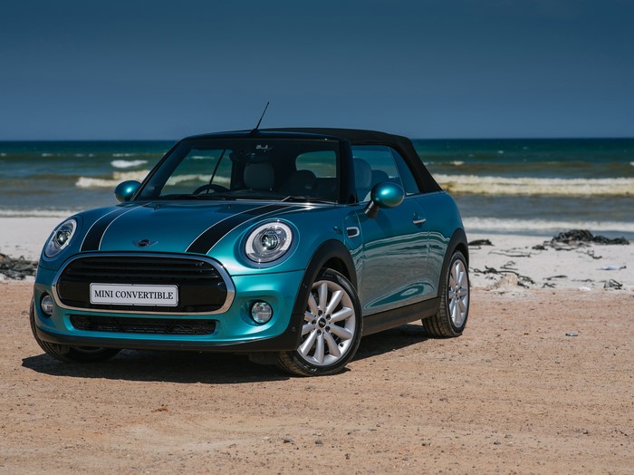 Teal Mini Cooper Convertible on a Beach