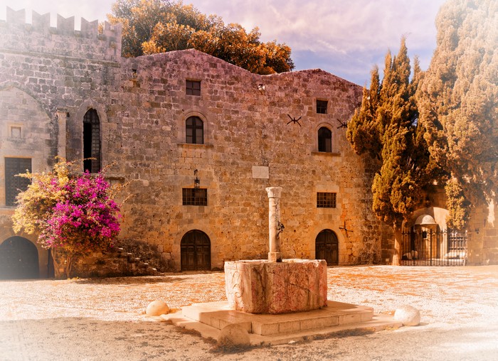 Stone building with well in Rhodes, Greece