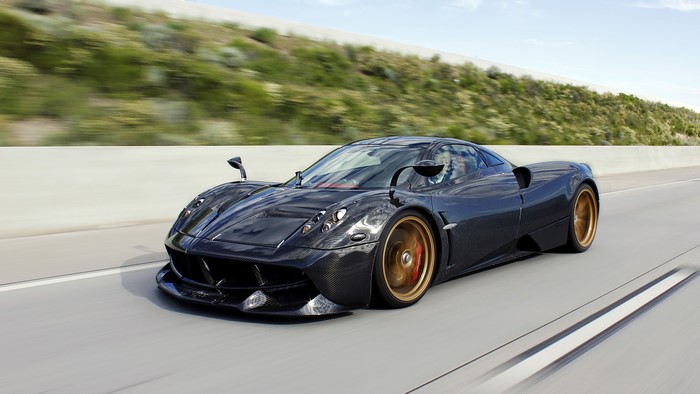 Black Pagani Huayra Pacchetto Tempesta driving on highway