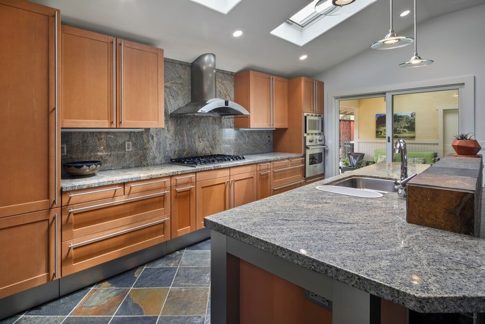 Modern Kitchen with Granite Countertops and Skylights