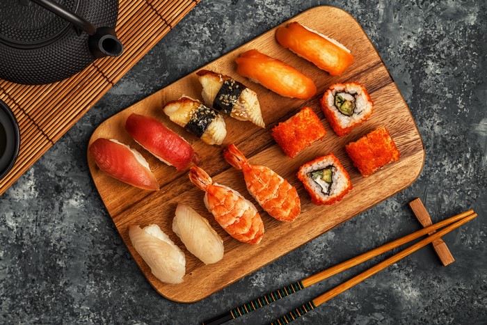 Sushi and Teapot on a Cutting Board