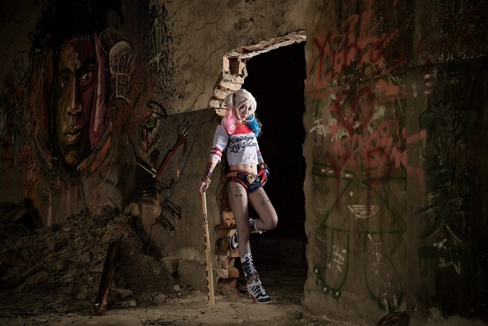 Harley Quinn with baseball bat in abandoned building