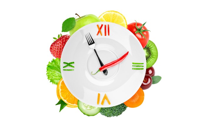 Creative Fruit Clock Face on Plate with Fork