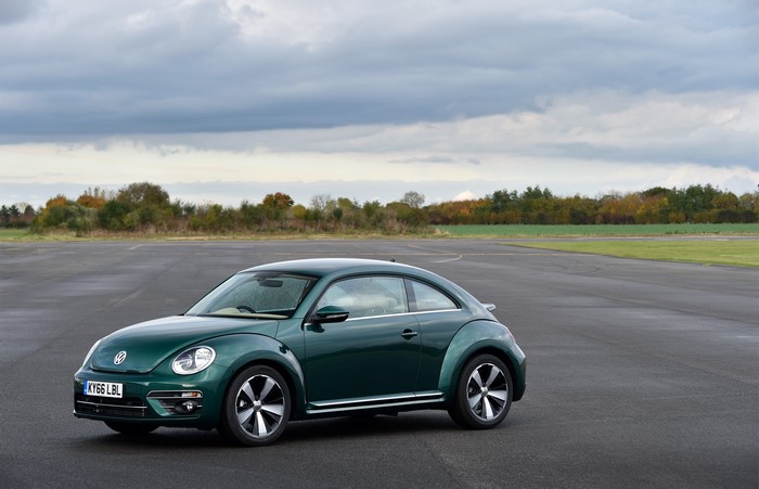 Green 2016 Volkswagen Beetle on a Racetrack