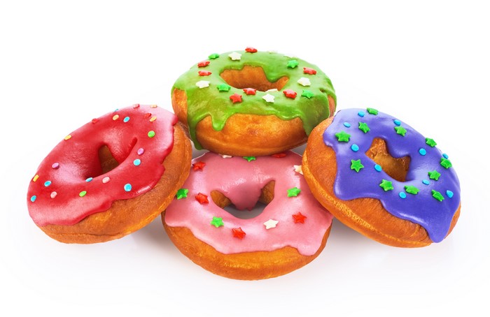 Four colorful donuts on a white background