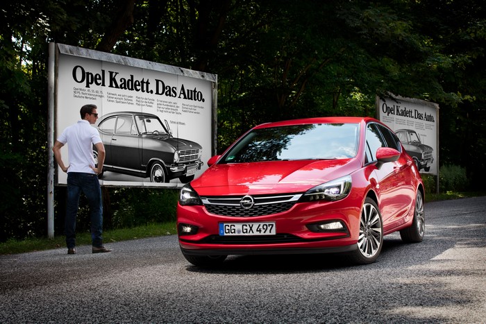 Red Opel Astra K with Opel Kadett Advertisement