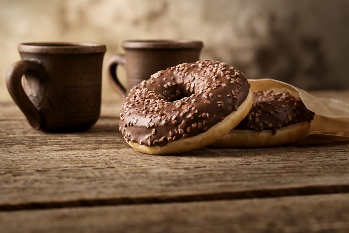 Chocolate donuts and cups