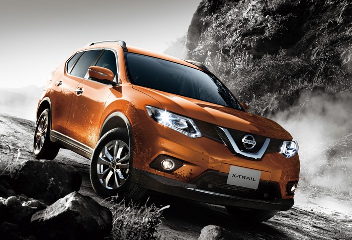 Orange Nissan X-Trail Crossover on Rocky Terrain