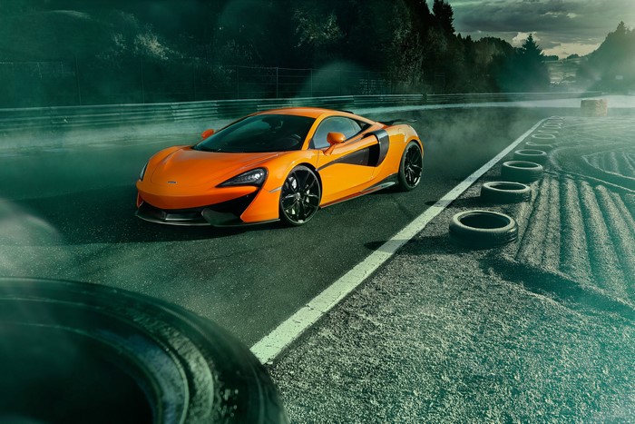 Orange McLaren 570S on a Race Track