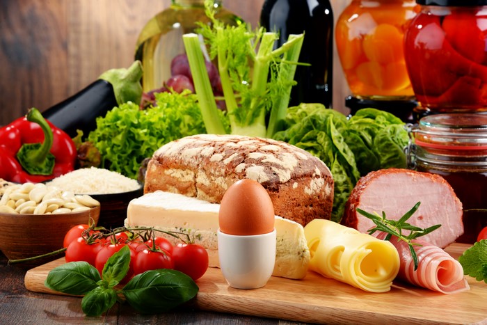 Assortment of Food: Bread, Cheese, Ham, Vegetables, and Eggs