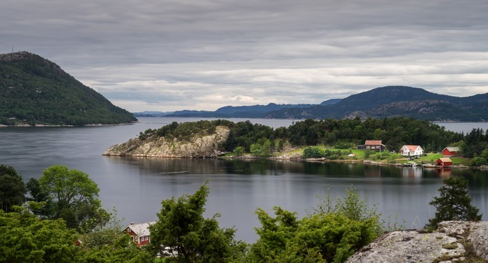 Houses on the coast of Norway with mountains