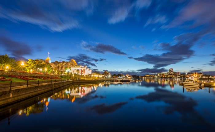 Cityscape with waterfront and reflections at dusk