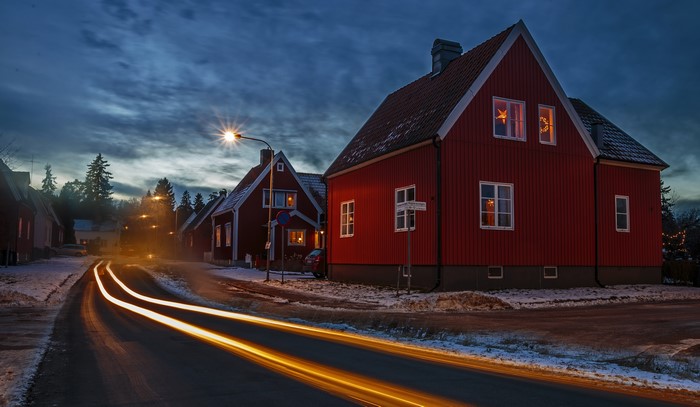 Red houses on a street in Stockholm, Sweden at dusk