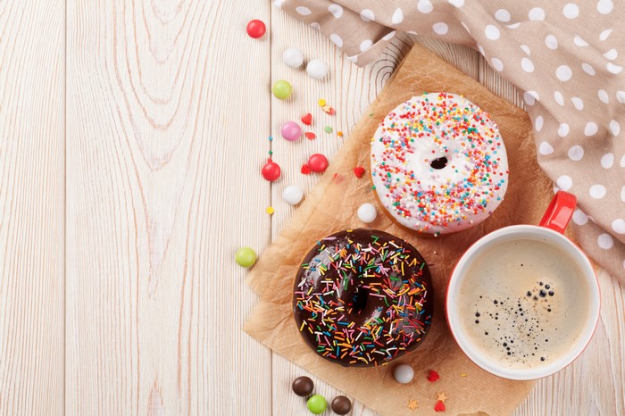 Donuts and Coffee with Candy on Wood