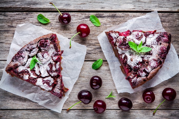 Cherry pie slices on wooden planks