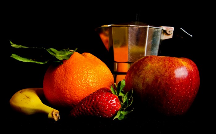Still life with fruits and coffee maker