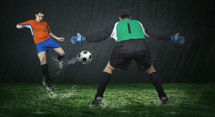 Soccer players in the rain