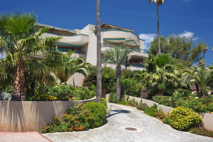 Apartment building with palm trees in Cavalaire-sur-Mer, France