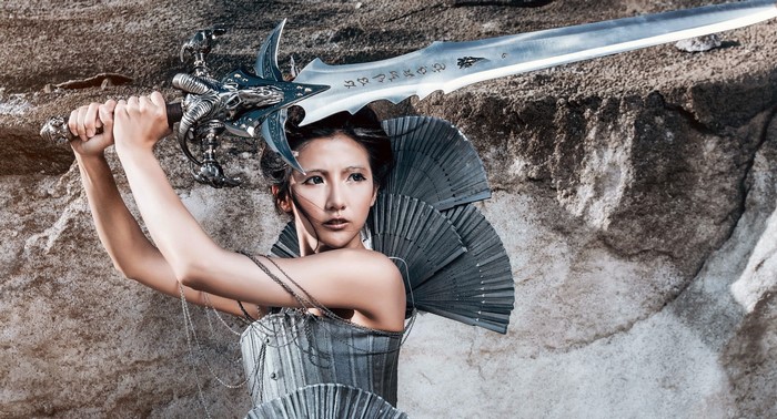 Woman in fantasy armor holding a sword