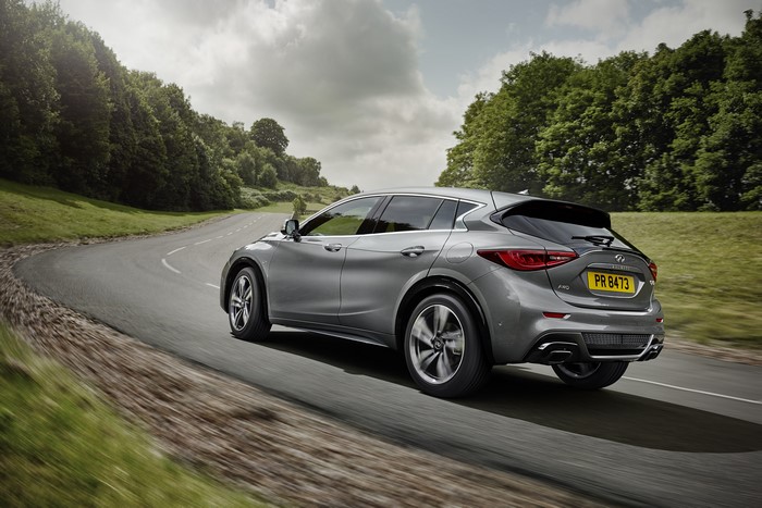 Infiniti Q30S driving on a winding road