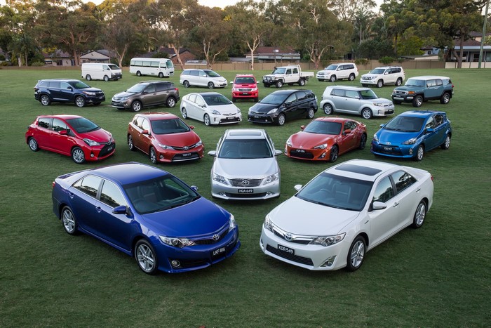 Toyota Cars and Vans on a Grassy Field