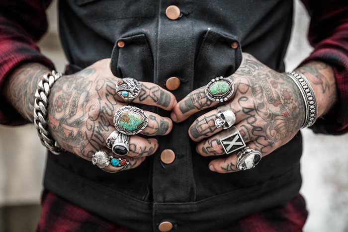 Tattooed Hands with Rings and Bracelets