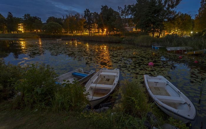 Boats on a lake in Sweden at dusk