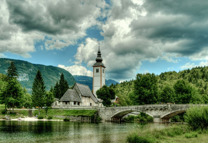 Church and bridge over a river in Ribcev Laz, Slovenia